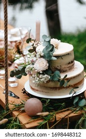 

Beautiful And Delicious Wedding Cake Decorated With Flowers In Boho Style