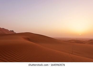 Beautiful Desert Sun Rise With Clear Sand Pattern Visible - Red Sands