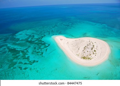 Beautiful Deserted Island In Coral Reef Ocean