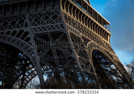 Similar – Eiffel Tower in green trees on blue sky