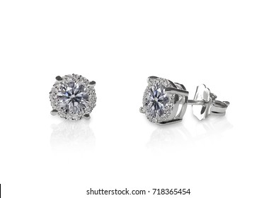 Beautiful Diamond stud earrings isolated on white with a reflection. Round Brilliant. - Shutterstock ID 718365454