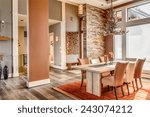 Beautiful Dining Room with Entryway, Table, Elegant Light Fixture in New Luxury Home