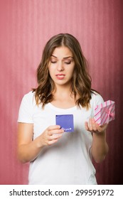 Beautiful Disappointed Girl With A Gift Box