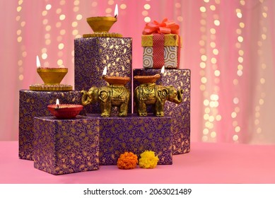 Beautiful diwali diyas with gift and flowers, Happy Diwali - Shutterstock ID 2063021489