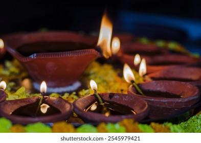 Beautiful Diyas lit up on the occasion of Diwali. - Powered by Shutterstock