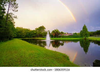 Beautiful double rainbow above a lake - Powered by Shutterstock