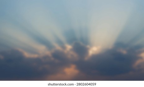 Beautiful and dramatic sun rays are bursting through dark, stormy clouds during a sunset, creating a breathtaking natural phenomenon.