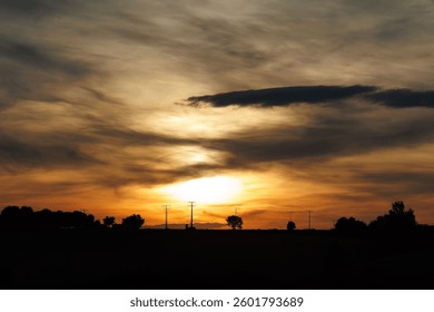 A beautiful dramatic sunset in the cloudy sky