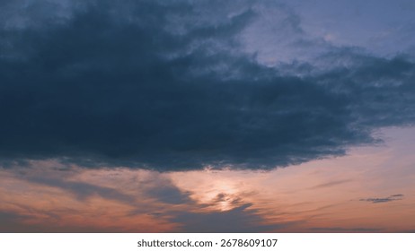 A Beautiful and Dramatic Sunset Creating a Unique Atmosphere Over a Cloudy Sky of Beauty