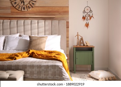 Beautiful Dream Catcher Hanging Near Bed In Stylish Room Interior