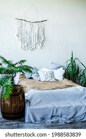 A Beautiful Dream Catcher Hanging Over The Bed In A Stylish Room Interior In White Shades