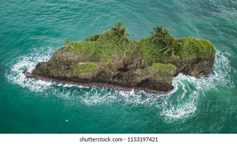 A Beautiful Drone Shot Of A Small Rocky And Overgrown Island On The Carribean Coast Of Costa Rica In Puerto Viejo.