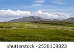 Beautiful dry stone walls, meadows, mountains and beautiful cloudy skies in the far northwest of Scotland close to Cape Wrath