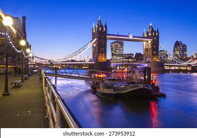 A beautiful dusk-time view of Tower Bridge and the River Thames in London.