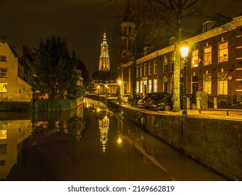 Beautiful Dutch street at night on canal side in Amersfoort, Netherlands