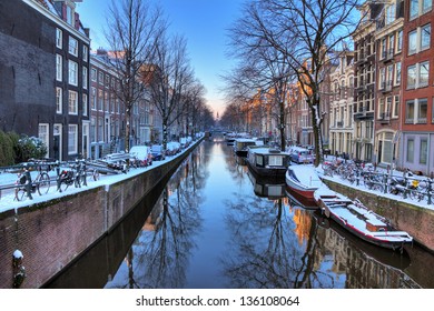 Beautiful early morning winter view on one of the Unesco world heritage city canals of Amsterdam, The Netherlands. HDR