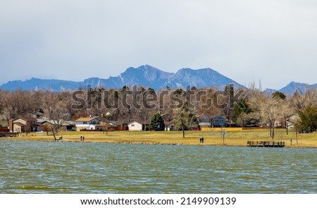 Beautiful early spring landscape with the Rocky Mountains in the distance in Lake Arbor Park, Denver, Colorado