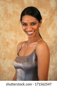 A Beautiful East Indian Has A Great Toothy Smile. Beautiful Olive Skin Tone.