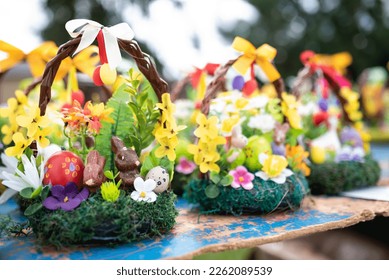 beautiful Easter decoration in traditional spring colors with Easter eggs, bunnies decorated with spring flowers - golden rain and primrose sold at an Easter market in South Bohemia
 - Shutterstock ID 2262089539