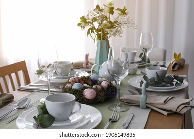 Beautiful Easter Table Setting With Festive Decor Indoors