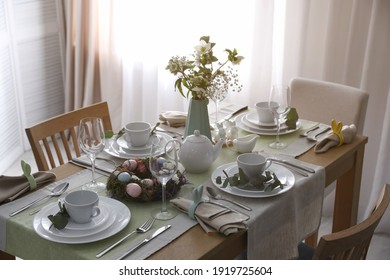 Beautiful Easter table setting with festive decor indoors - Powered by Shutterstock