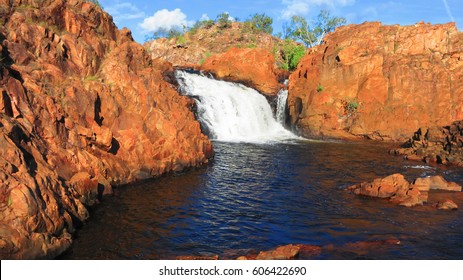 Beautiful Edith Falls waterfall with red rocks in the Northern Territory NT, Australia near Pine Creek