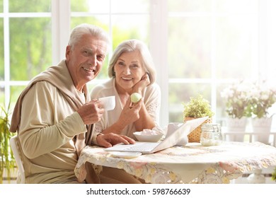 Beautiful elderly couple having breakfast  - Powered by Shutterstock