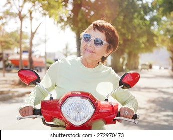 Beautiful Elderly Woman 50 Years Old On Motorbike