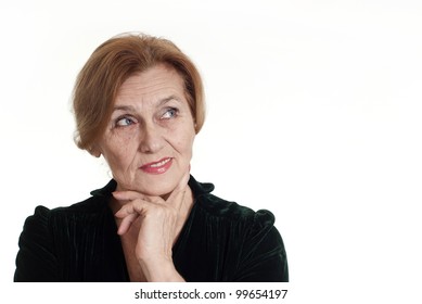 an beautiful elderly woman in a dress standing on white