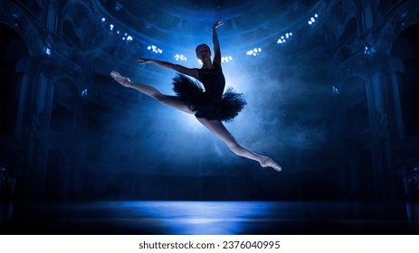 Beautiful, elegant, artistic young woman, ballerina in motion, jumping, dancing on theater stage with spotlights. Concept of classical dance, art and grace, beauty, choreography, inspiration - Powered by Shutterstock