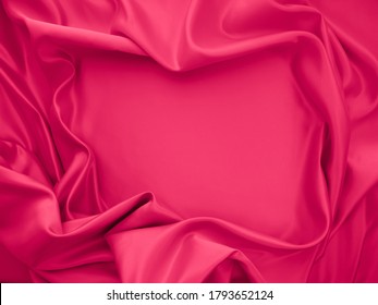 Hermosa y elegante textura de tela de tela de tela de tela de tela de seda rosa fucsia rosa  diseño de fondo abstracto  
