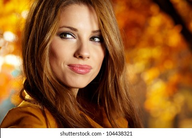 Beautiful Elegant Woman Standing In A Park In Autumn