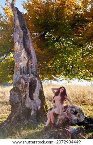 Similar – Woman with a bike in the middle of the forest.