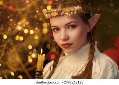 A beautiful elf girl in a nightgown stands in a fabulous Christmas setting. Fantasy. The magic of Christmas night.