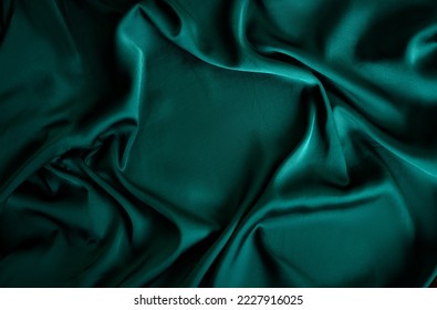 Beautiful emerald green soft silk fabric.Texture, background, pattern. Texture of green silk fabric. - Shutterstock ID 2227916025