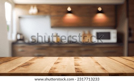 Beautiful empty brown wooden table top and blurred defocused modern kitchen interior background with daylight flare, product montage display.