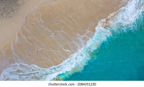 Beautiful Empty Kelingking Beach And Azure Tropical Sea. Top View Of The Seascape. Ocean And Sand. Copy Space. Ariel View On Beach With Waves. Nusa Penida Island, Bali, Indonesia.