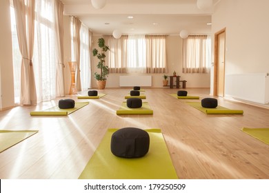 Beautiful, empty naturally lit yoga studio. 