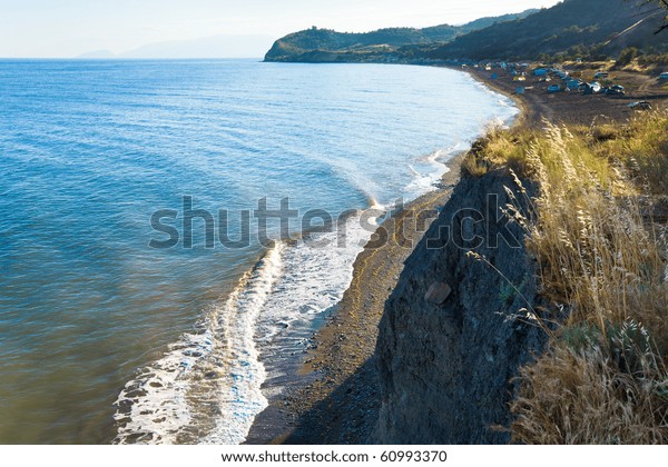 Beautiful evening summer coastline and camping\
on beach (Crimea,\
Ukraine).