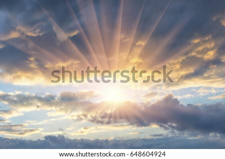 Beautiful evening sunset with clouds and sun rays