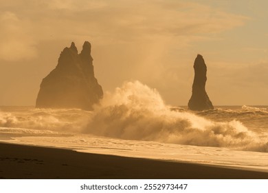 Beautiful and exciting sunrise in Reynafjara (Iceland), with a spectacular atmosphere and a powerful wave being the third element and protagonist of the photo. - Powered by Shutterstock