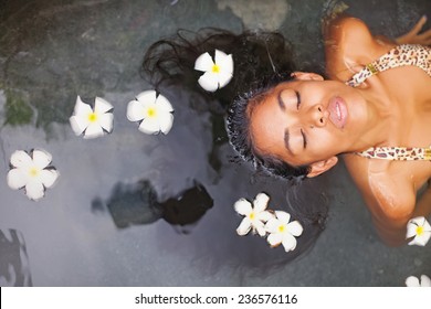 Beautiful Exotic Woman Having Bath In A Luxury Spa Salon