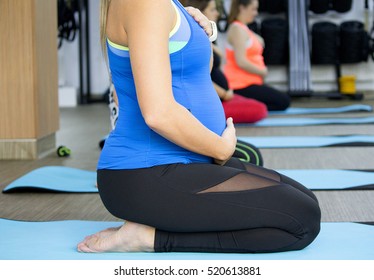 Beautiful expecting mothers on fitness class at the gym. - Powered by Shutterstock