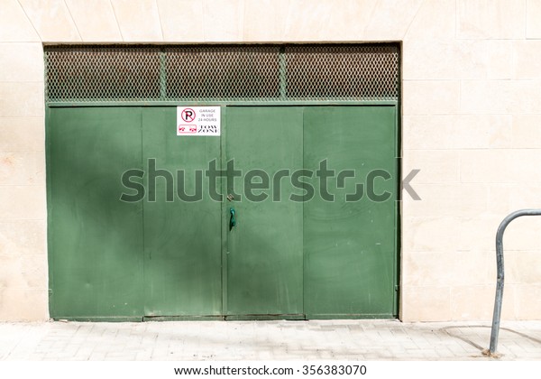 beautiful Exterior Garage Door architecture made from\
wood protecting the cars people store inside in Valletta Malta /\
Garage Doors 5