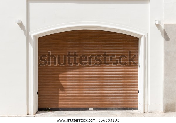 beautiful Exterior Garage Door architecture made from\
wood protecting the cars people store inside in Valletta Malta /\
Garage Doors 1