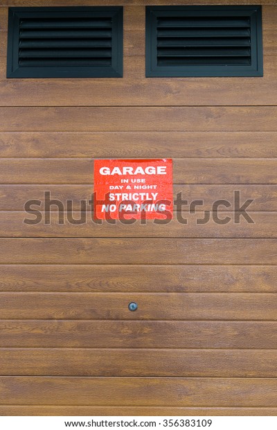 beautiful Exterior Garage Door architecture made from\
wood protecting the cars people store inside in Valletta Malta /\
Garage Doors 11