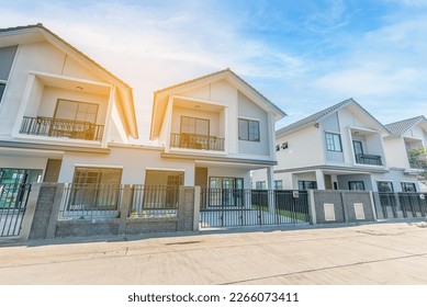 Beautiful exterior of modern twin house just finished, Front View of New Residential house, the architectural design of the exterior with blue sky, The concept for Sale,Rent, Housing, and Real Estate. - Shutterstock ID 2266073411