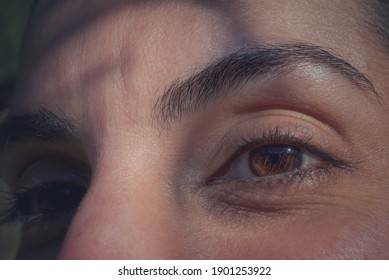 beautiful eyes of a woman looking far. feeling content and happy - Shutterstock ID 1901253922