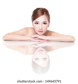 Beautiful face skincare beauty woman lying down with mirror reflection isolated on white background. asian beauty model