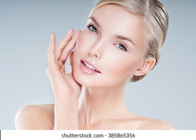 Beautiful Face Of Young Adult Woman With Clean Fresh Skin.